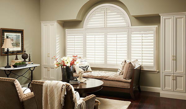 arched window shutters in living room