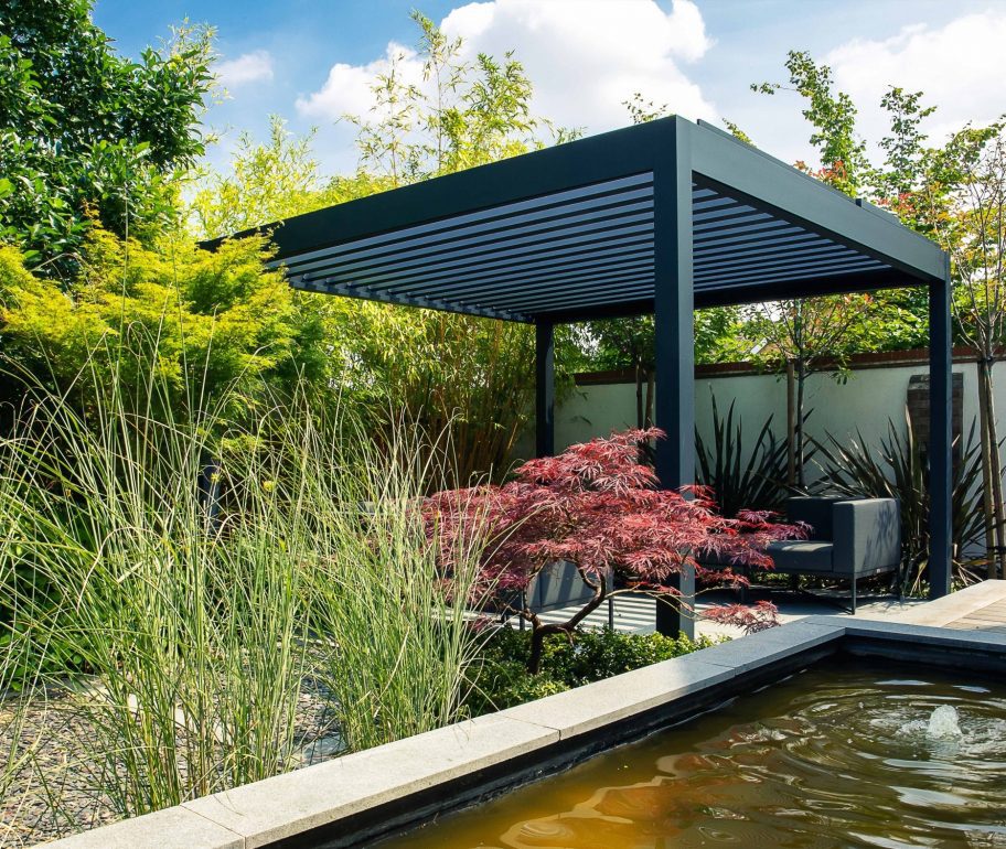 Freestanding veranda with louvred roof over outside seating area