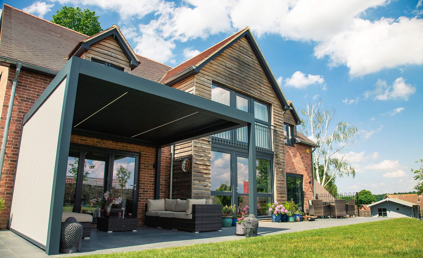 Outdoor pod with side panels over patio seating area